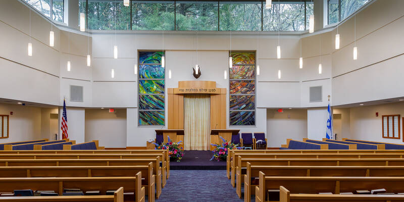 Wide angle image of Or Atid sanctuary taken from back showing pews and bimah