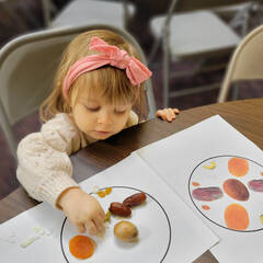 Image of toddler working on crafts